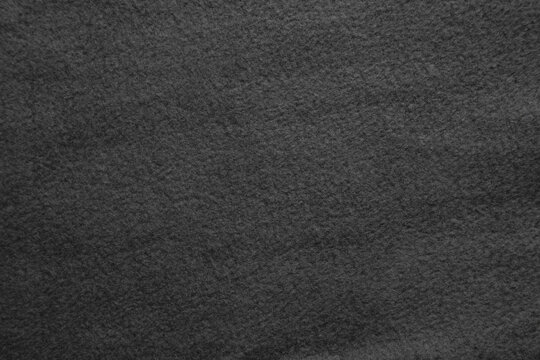 Texture of warm woolen fabric. Gray felt back. © solidmaks
