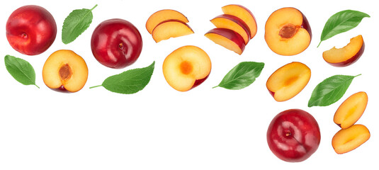 fresh red plum and half with leaves isolated on white background with copy space for your text. Top view. Flat lay