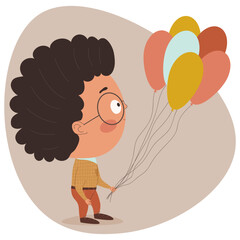 
A curly boy with glasses in his hand is holding a balloons.