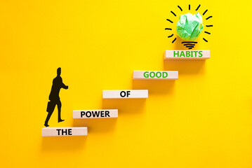 The power of good habits symbol. Concept words The power of good habits on wooden block. Beautiful yellow table yellow background. Businessman icon. Business power of good habits concept. Copy space.