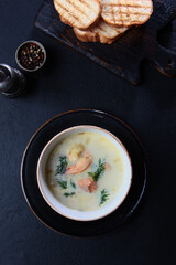 Soup with seafood and cream. Shrimp and redfish in a traditional French soup.Flat lay.Top view. Copy space.