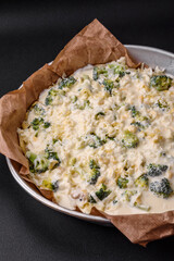 Delicious quiche with broccoli, cheese, chicken, spices and herbs