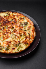 Delicious quiche with broccoli, cheese, chicken, spices and herbs