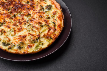Delicious quiche with broccoli, cheese, chicken, spices and herbs
