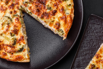 Delicious quiche with broccoli, cheese, chicken, spices and herbs