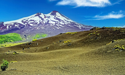 Sierra Nevada hiking trail through lava ash hills to volcano Llaima -Conguillio NP, Chile