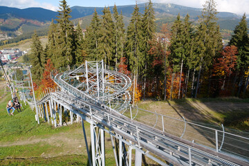 People on ski lift in Bukovel village, largest ski resort in Carpathians