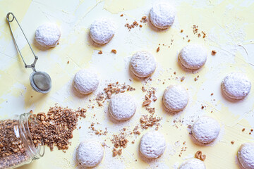 Kahk cookies served on a table in patterns sprinkled with sugar (Kahk is a traditional cookies in the arab world, served in Eid el fitr, a feast after Ramadan)
