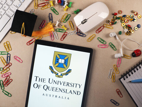 In this photo illustration,  The University of Queensland  logo seen displayed on a tablet.