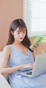 asian girl using mobile notebook