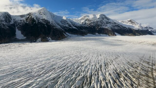 Sunny Skies Over Juneau Icefield Taku Glacier Amidst Towering Mountains