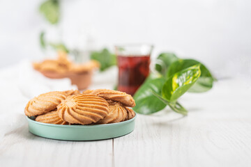 English tea and biscuits on a white wooden background
