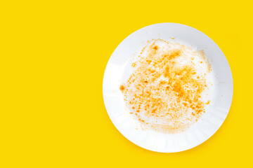 Dirty dishes on yellow background. Top view
