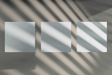 Mockup of a three square greeting cards with striped shadow overlay