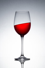 studio photography, crystal glasses with colored liquids in mirrors