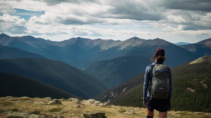 backside of a satisfied hiker looking at mountains and valley, ai generated