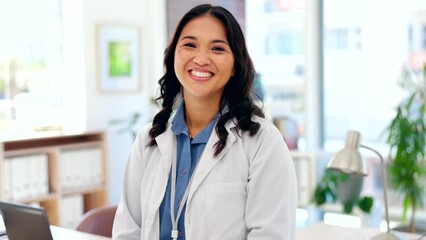 Portrait, healthcare and a doctor asian woman in her office in a hospital looking happy about treatment. Medical, trust and smile with a female medicine professional working in a clinic for insurance - Powered by Adobe