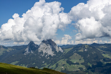Fototapeta premium Beautiful view of the Swiss mountains with clouds.