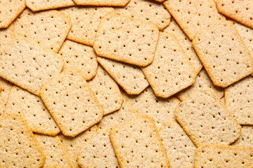 Many tasty crackers as background