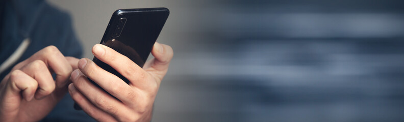 the man holding smart phone