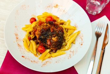 Chicken supreme with herbs and pasta. French cuisine
