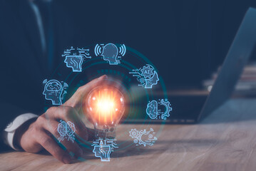AI technology concept, man using AI tech to working business project, businessman working on computer laptop and touching light bulb with AI icons, creative and new idea concept.