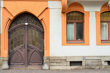 Fototapeta premium View of old building with wooden door and windows