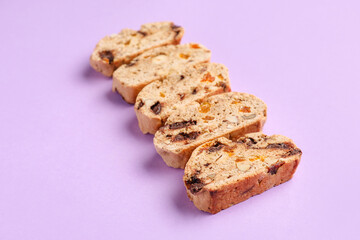 Delicious biscotti cookies on lilac background