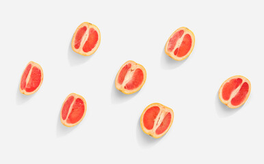 Pieces of ripe grapefruit isolated on white background