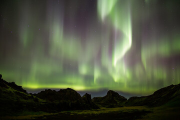 Aurora borealis column over mountains, Nesjavellir Iceland