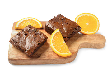 Wooden board with pieces of tasty chocolate brownie isolated on white background