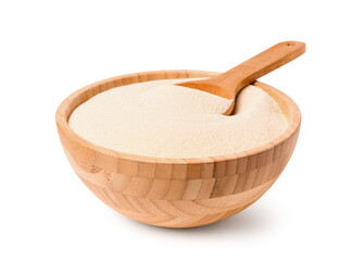 Bowl of raw semolina on white background