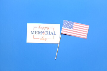 Greeting card with text HAPPY MEMORIAL DAY and USA flag on blue background