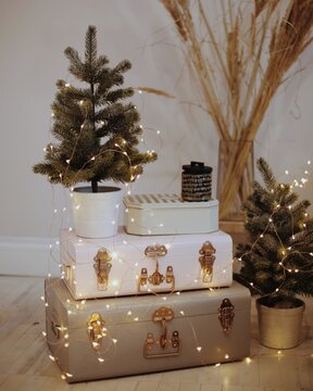 Suitcases decorated with string light and christmas decoration
