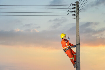 Electrician climbing a utility pole
