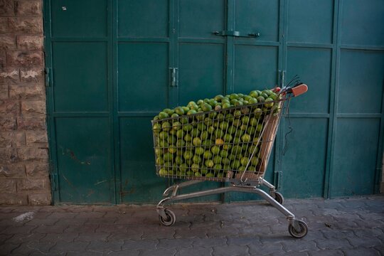 Shopping cart filled with limes
