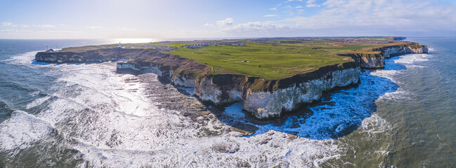 Stunning Flamborough Head from drone sea perspective. Sunny weather over famous white chalk cliffs. Panoramic shot. High quality photo © PoppyPix