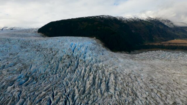Amazing Aerial Shot of Taku Glacier Flowing into the River, Near Juneau Alaska
