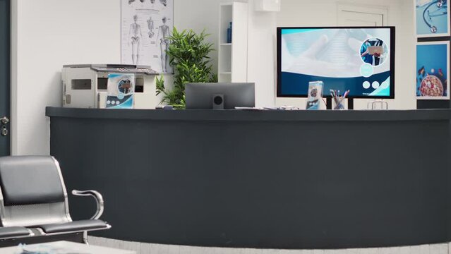 Waiting room lobby at hospital reception, checkup appointment papers on front desk to help with health care system and insurance. Medical diagnostic center in clinic waiting space.