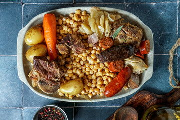 Cocido Madrileño, a traditional Spanish meal, chickpea-based stew from Madrid                     ...