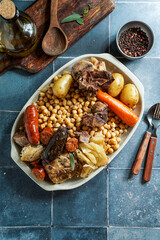 Cocido Madrileño, a traditional Spanish meal, chickpea-based stew from Madrid                     ...