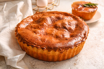 Delicious meat pie on white grunge table