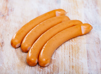 Popular Czech boiled sausages (Parky) made of pork and beef on wooden table..