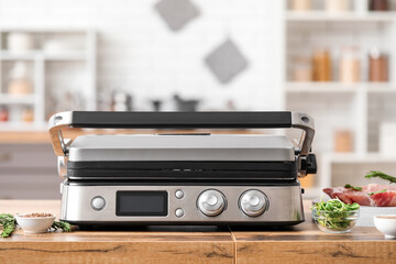 Obraz premium Modern electric grill on table in kitchen
