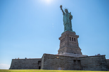 Fototapeta na wymiar Statue of Liberty during sunny day in New York. Symbol freedom of the USA.