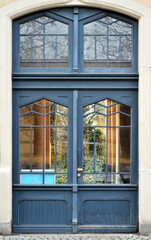 Fototapeta na wymiar View of old building with blue wooden door