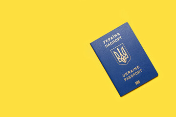 Ukrainian passport on yellow background