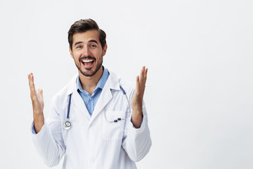 man doctor in a white coat with a stethoscope and wearing glasses for a smile hands up victory and...