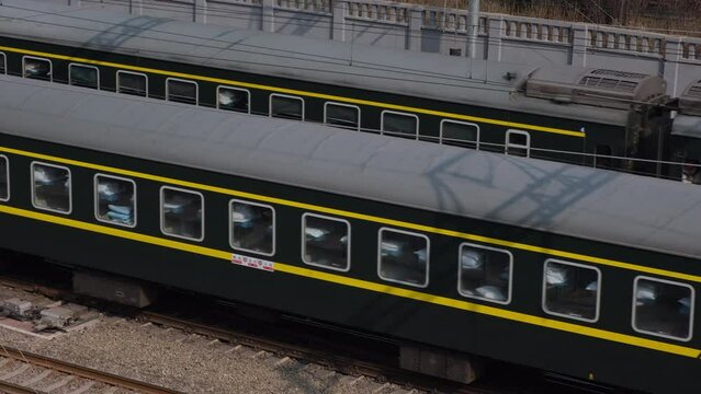 Close up of train compartments running on rail, Beijing, China. 