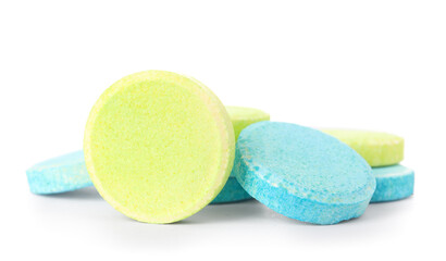 Blue and green soluble tablets isolated on white background